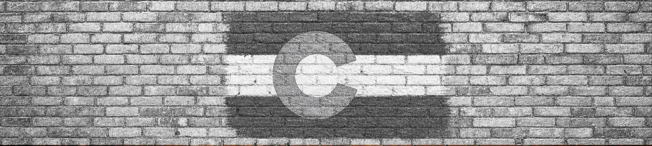 Colorado flag painted on a brick wall
